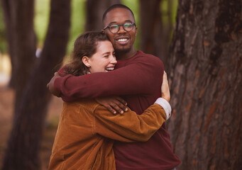 Love, hug and couple together in outdoor for camping in wilderness on anniversary date in Norway, countryside. Interracial people, travel and happiness on vacation in forest for peace and adventure.