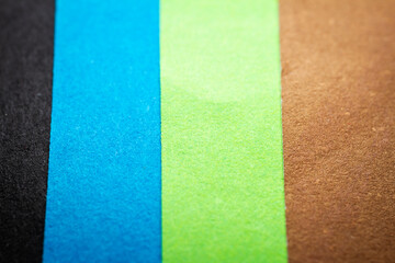 Extreme macro of multicolor background from different colors papers