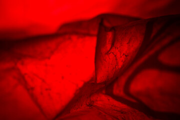 Extreme close up of red empty plastic bag background.