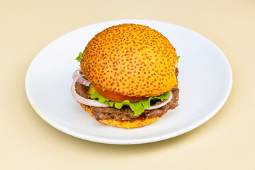 Big tasty burger with beef cutlet on a plate. Hamburger, cheeseburger with mushroom. Crispy chicken burger.