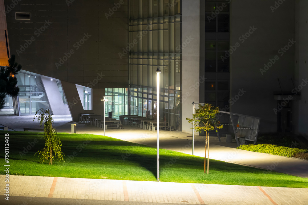 Wall mural modern university campus with modern illumination at night