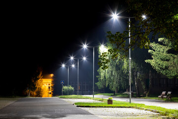 empty parking area with safety modern illumination at night - 790112884