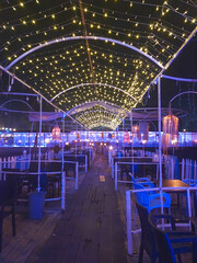 Night view of a restaurant decorated with blue lights, closeup of photo