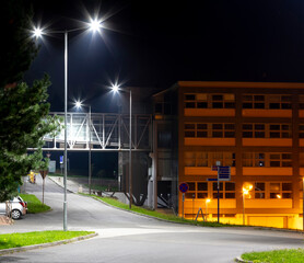 modern university campus with modern illumination at night - obrazy, fototapety, plakaty