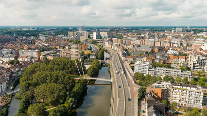 Ghent, Belgium. Esco (Scheldt) river embankment. Panorama of the city from the air. Cloudy weather,...