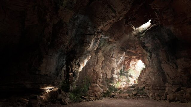 A dark cave with light coming from the entrance