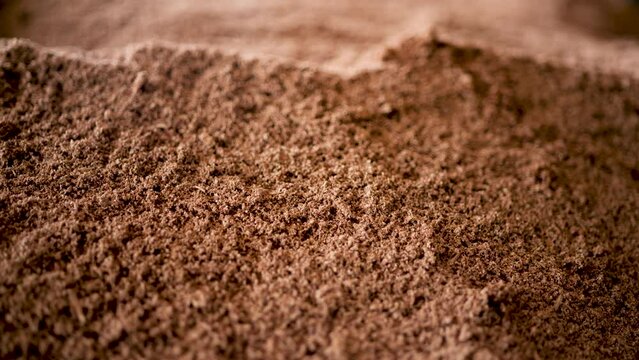 Mixing soil for growing mushrooms.