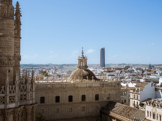 Fototapeta na wymiar View of the town of Seville with the Sevilla Tower in the background as seen from the tower of Giralda