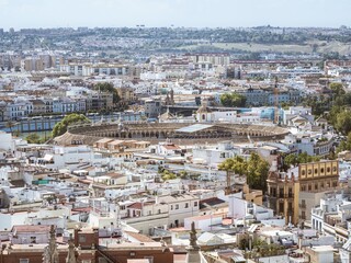 View of the town of Seville with the Plaza de Toros as seen from the tower of Giralda