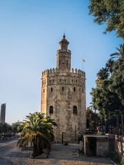 Fototapeta na wymiar The Torre del Oro tower bastion in Seville, Andalusia, Spain, next to the Guadalquivir river