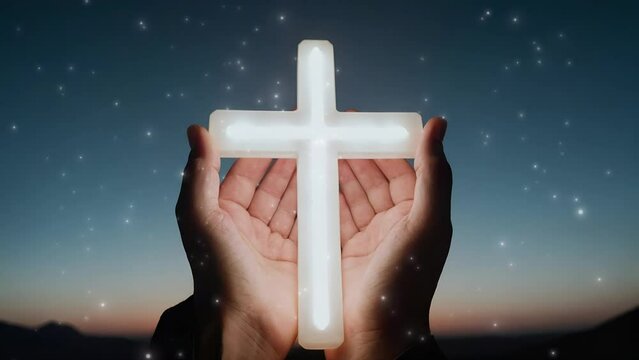 hands holding a cross