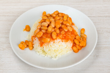 Traditional turkish bulgur pilaf with tomato sause in plate (Turkish name; bulgur pilavi, meyhane pilavi) Pirinc pilavi. Pilavustu tavuk, nohut, kuru fasulye, ciger.