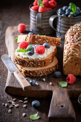 Homemade and sweet whole grain bread with cheese and fruit.