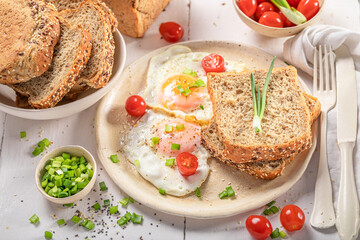 Delicious and crisp breakfast with fried eggs and bread.
