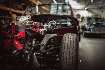 Classic cars being restored in a vintage vehicle garage workshop - Powered by Adobe
