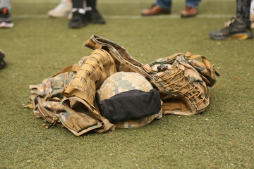 Military helmet with vest on the field