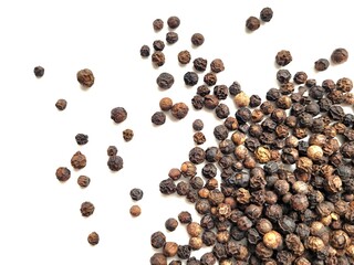Black pepper seeds isolated on a white background.