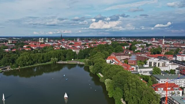An aerial drone view of Aasee Lake in M&uuml;nster . Lake Aasee is an artificial lake located in M&uuml;nster , Germany .
