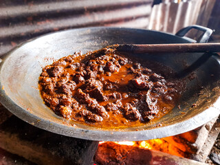 Beef Rendang food being cooked. one of the popular traditional Indonesian foods