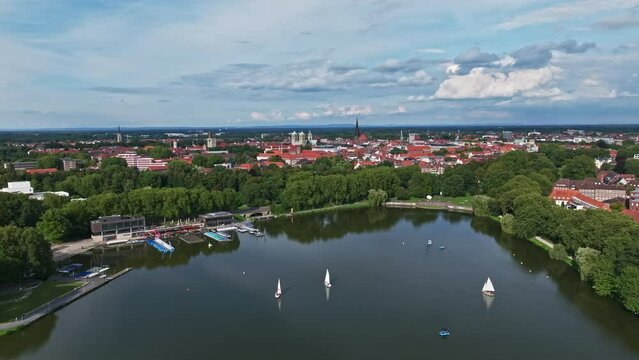 An aerial drone view of Aasee Lake in M&uuml;nster . Lake Aasee is an artificial lake located in M&uuml;nster , Germany .