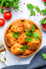 Meatballs with tomato sauce in bowl on white table background. Top view - 790156675