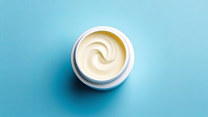 cream in a white jar on a blue background