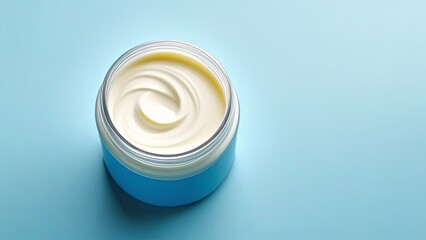 cream in a white jar on a blue background 
