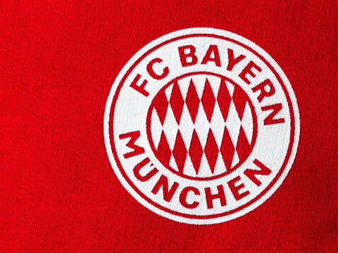 In this photo illustration,  FC Bayern Munich logo seen displayed on a sportswear