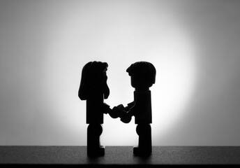 silhouette of a lovely couple made with toys