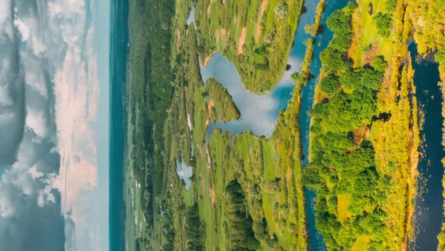 Timelapse Dronelapse Hyperlapse Aerial View Spring Forest Woods And Curved River Marsh. Springtime Landscape. Top View From High Attitude In Summer Season. Drone View, Hyperlapse. Bird's Eye View