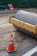 Partial view of a heavy roller machine  at a road construction site