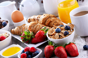 Breakfast served with coffee, juice, croissants and fruits - 790186846