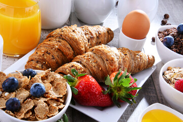 Breakfast served with coffee, juice, croissants and fruits - 790186851