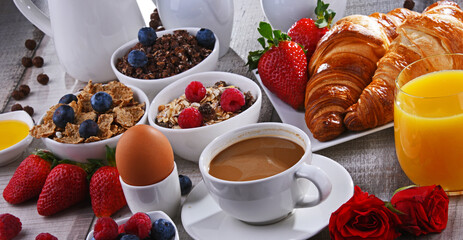 Breakfast served with coffee, juice, croissants and fruits