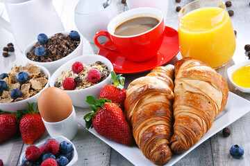 Breakfast served with coffee, juice, croissants and fruits