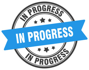 in progress stamp. in progress label on transparent background. round sign