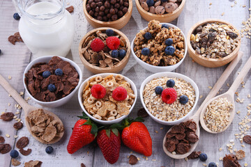 Bowls with different sorts of breakfast cereal products - 790193067