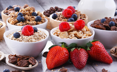 Bowls with different sorts of breakfast cereal products