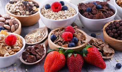 Bowls with different sorts of breakfast cereal products