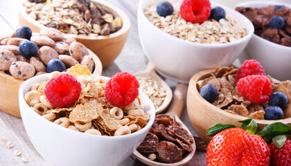 Bowls with different sorts of breakfast cereal products - 790193492