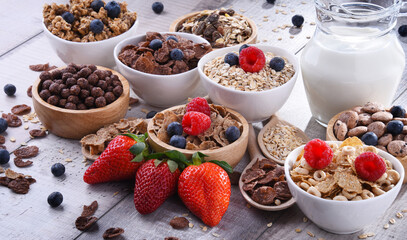 Bowls with different sorts of breakfast cereal products - 790193621