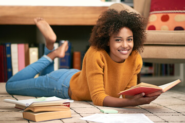 African woman, novel and portrait on floor in library for learning, relax and self study for...