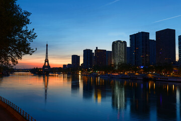 View of Eiffel Tower and river Seine at sunset in Paris, France.