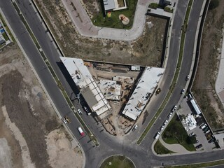 Сity development. Aerial view from drone, construction, Building construction site.