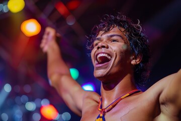 An enthusiastic young man is celebrating in a lively atmosphere with colorful lights, possibly at a party or event