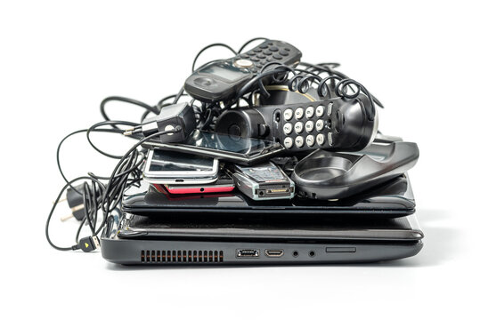Electronic waste ready to recycle, isolated on white background. pile of mixed electronic waste, old broken computer parts, laptops, cell phones