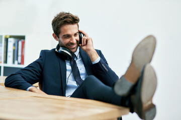 Businessman, office and headphones with music for relax on break with smile for stress relief....