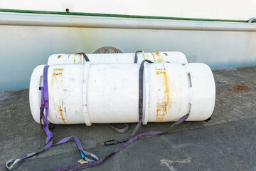 two freon gas cylinders are located outside on the harbor quay