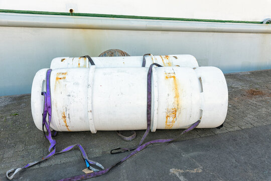two freon gas cylinders are located outside on the harbor quay