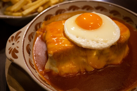 The iconic Portuguese French Sandwich also known as "Francesinha Especial", Porto, Portugal.